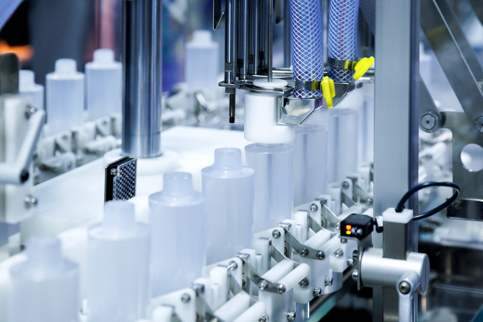 Automated production line handling finished HDPE bottles